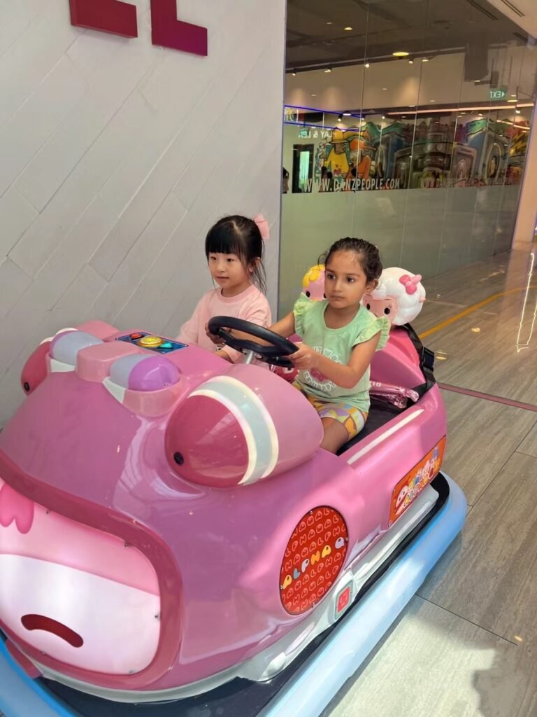 Interactive power wheels kiddie ride with LED effects